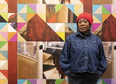 Artist Sonia Boyce standing in room 5 at the British Pavilion, 2022