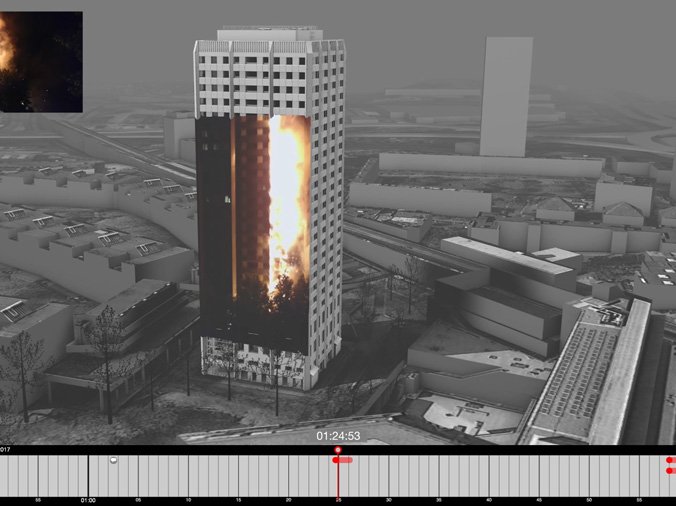 A board showing an image of the burning tower imposed in front of Grenfell tower.