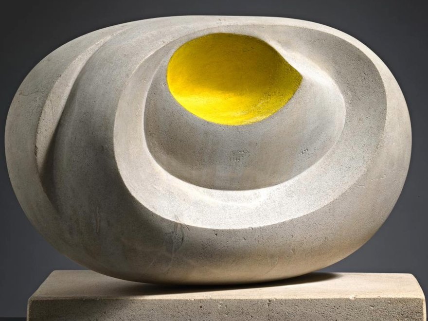 a sculpture with a splash of yellow
