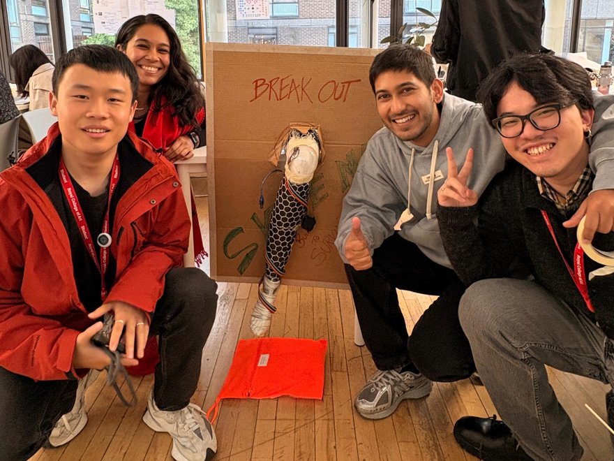 A group image of people pose for a photo