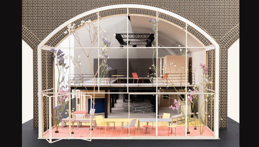 A detailed architectural model or diorama of a multi-level interior space.