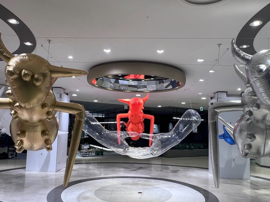 A photo of giant inflatable insects installed in a public space