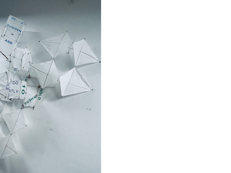 A collection of kites made with white paper