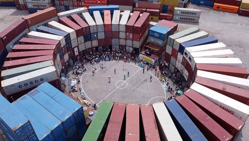 a temporary football stadium constructed from shipping containers in Naples, Italy