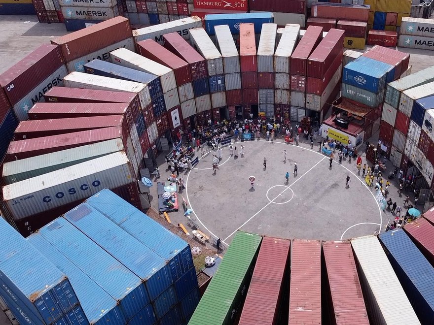 a temporary football stadium constructed from shipping containers in Naples, Italy