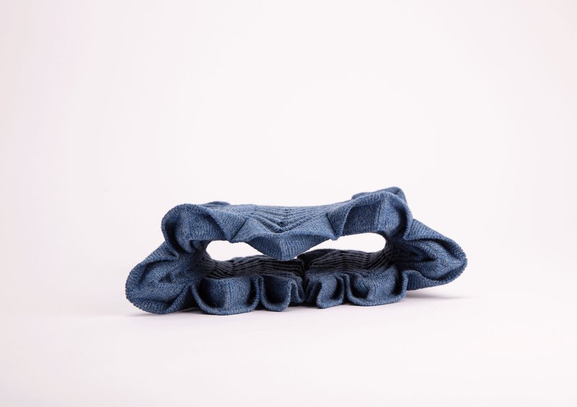 Deployable origami woollen knit model for collaboration with George Thornton