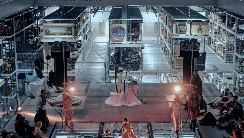 a performance or event within the Weston Collections Hall at the V&A East Storehouse in London.