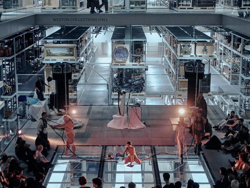 a performance or event within the Weston Collections Hall at the V&A East Storehouse in London.