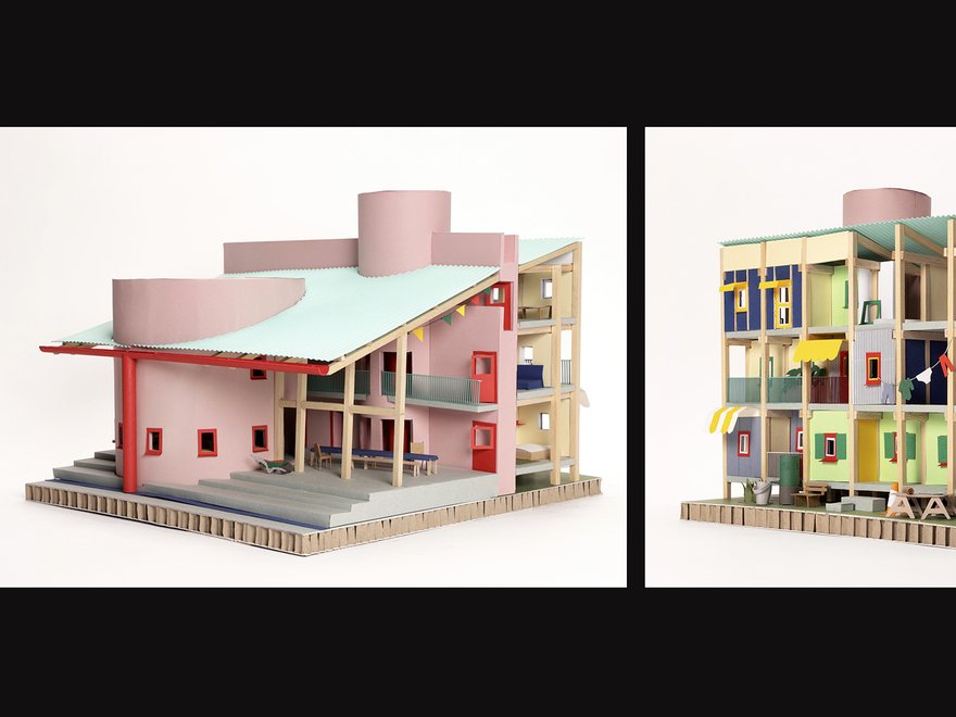 The model depicts a multi-story building with a light pink exterior and a light blue slanted roof.