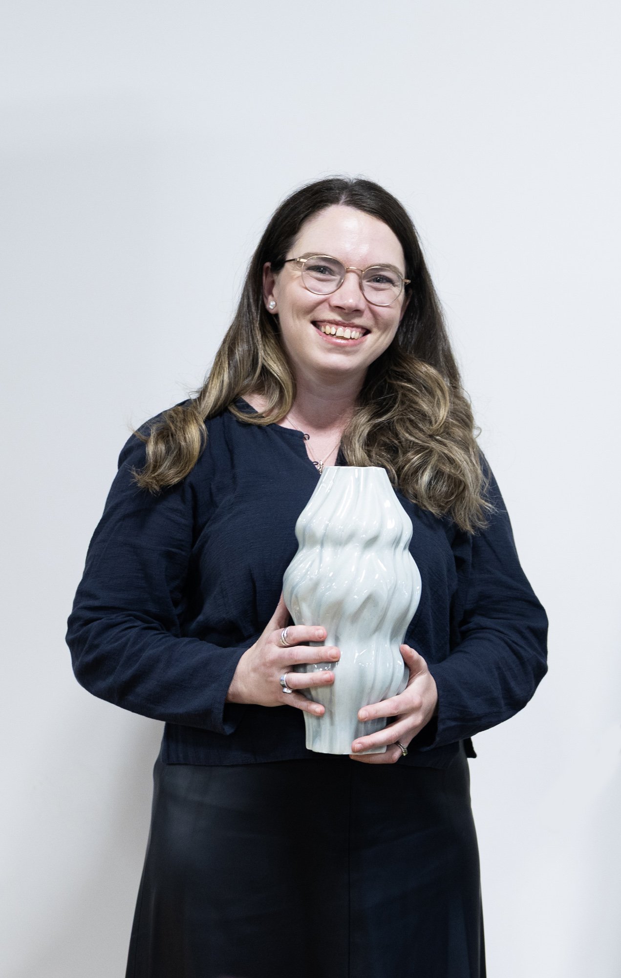 Alumni winner Mikaela Patrick poses with the award