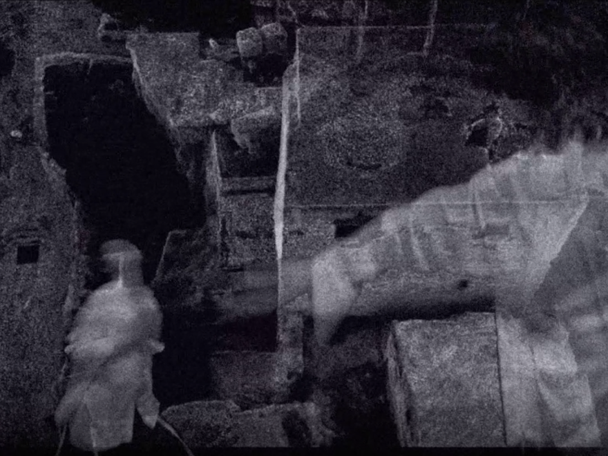 A black and white still image from an experimental film