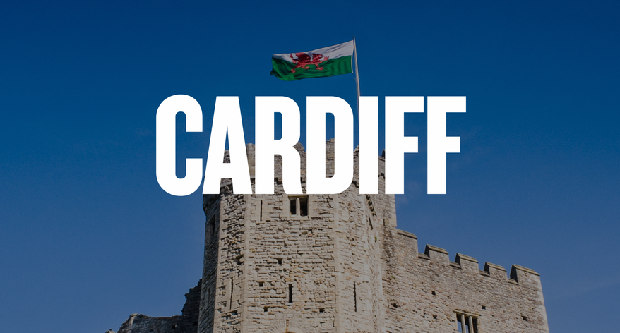 Cardiff Castle in Wales with CARDIFF written in large white letters in the centre
