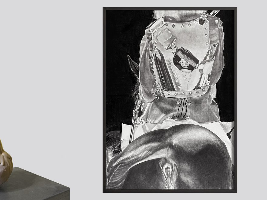 A photo of an amorphous statue and painting of a headless figure riding a horse, shown from from behind