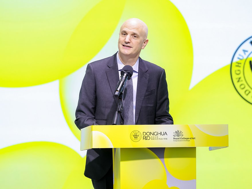 Christoph Lindner speaks at a podium at launch of RCA Shanghai Centre