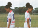 In two images, a girl poses on a football pitch to show a football shirt decorated with slogans such as Black Lives Matter