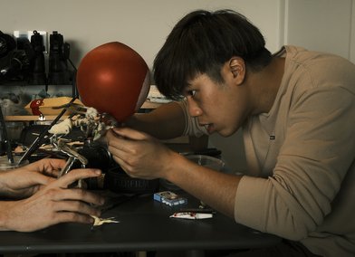 Kasidech Kumwongdee working on group stop-motion project 'Balloon Chicken'