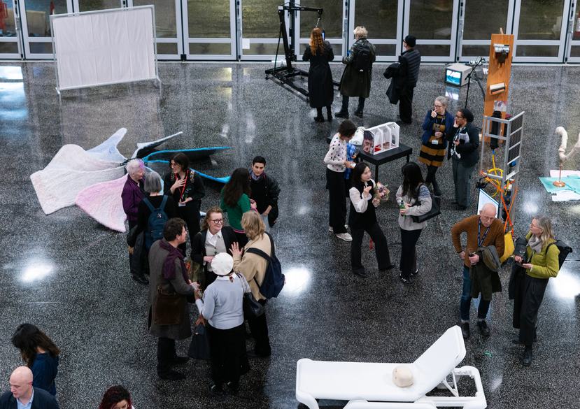 People gather at the Research Biennale