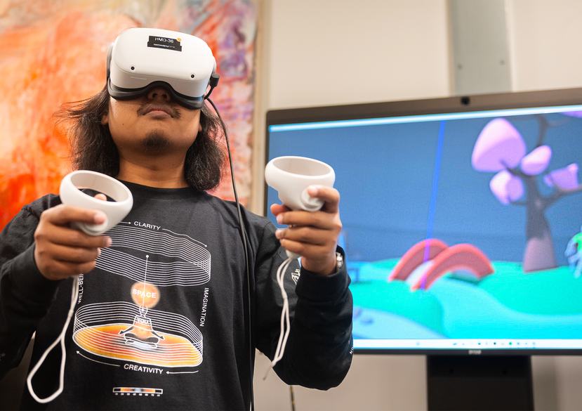 A student demonstrating VR