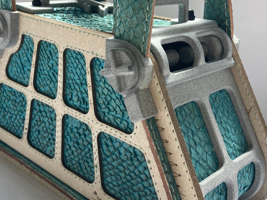 A futuristic handbag made with green fish leather with "bolt" detail