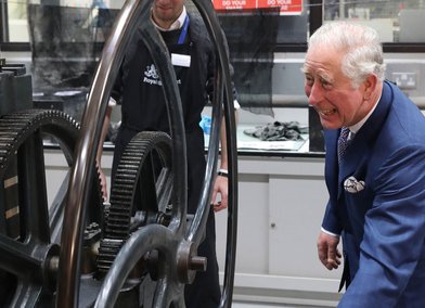His Royal Highness The Prince of Wales creates a print with the 'Hockney Press'
