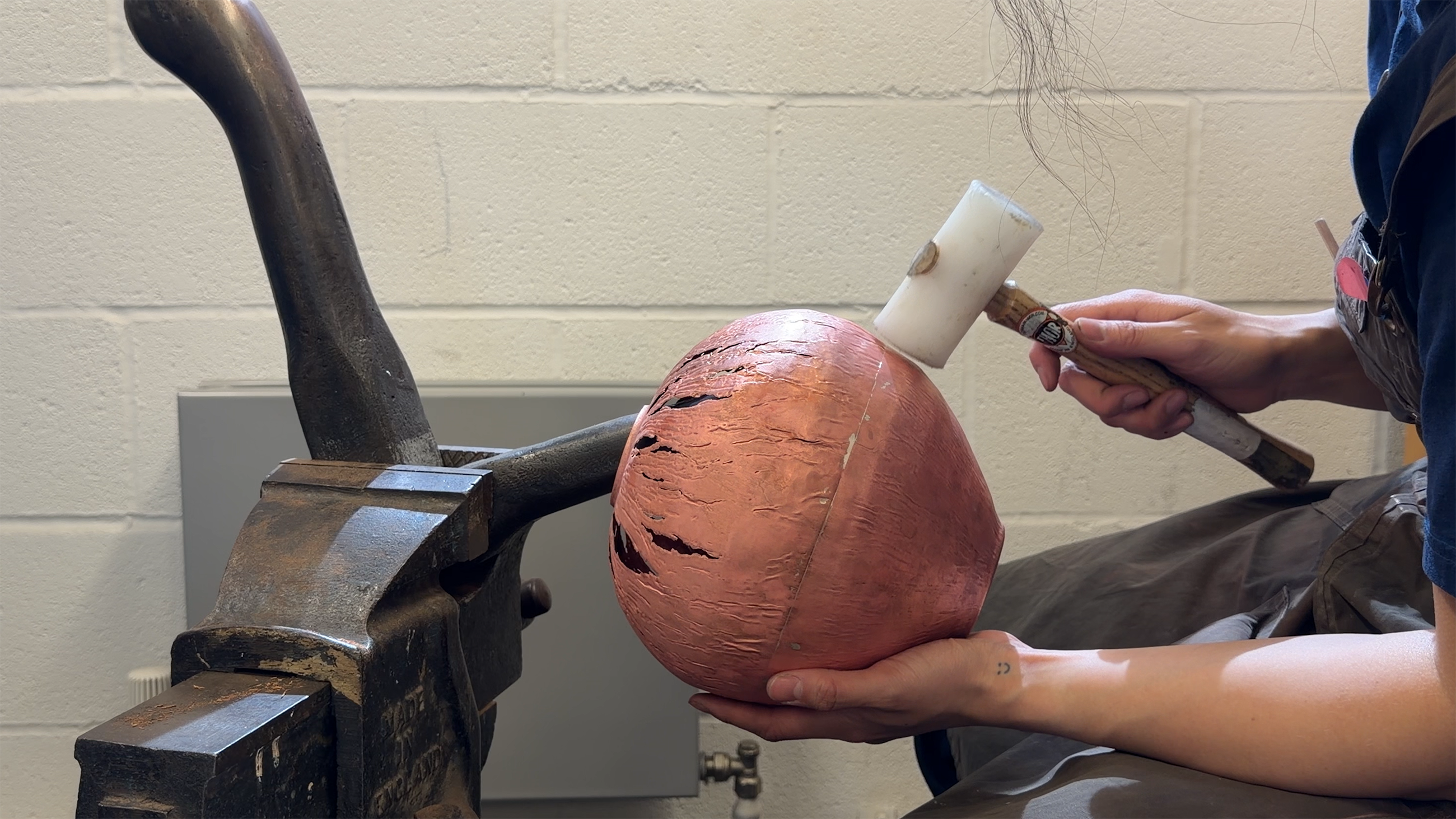 Hammering copper during the forming process