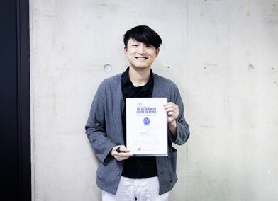 Hanming Xu receiving the Helen Hamlyn Design Award at the RCA Battersea campus