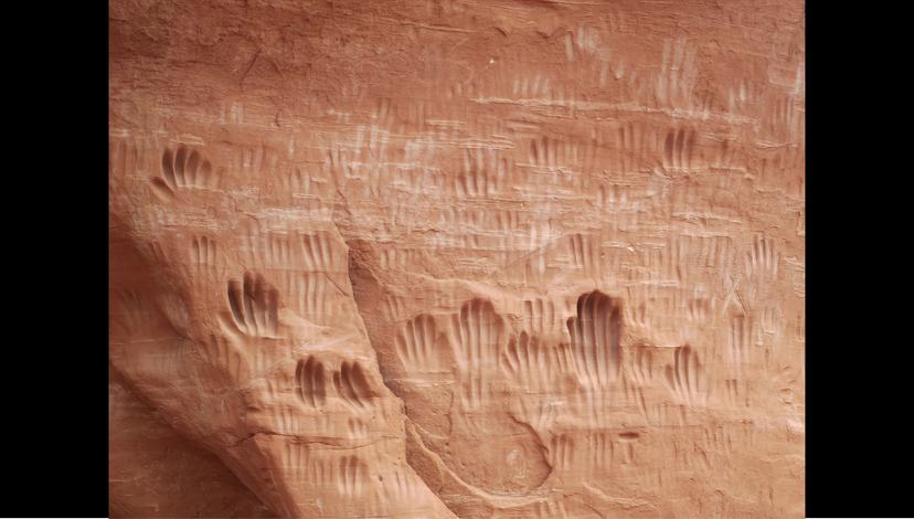 ‘Handprints in Entrada Sandstone’: repeated touch leaves a record embedded in the wall. Source: geology.utah.gov
