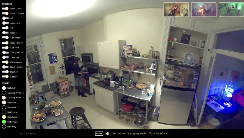A screenshot of a smart home interface displaying a wide-angle, slightly distorted view of a kitchen and adjacent rooms.
