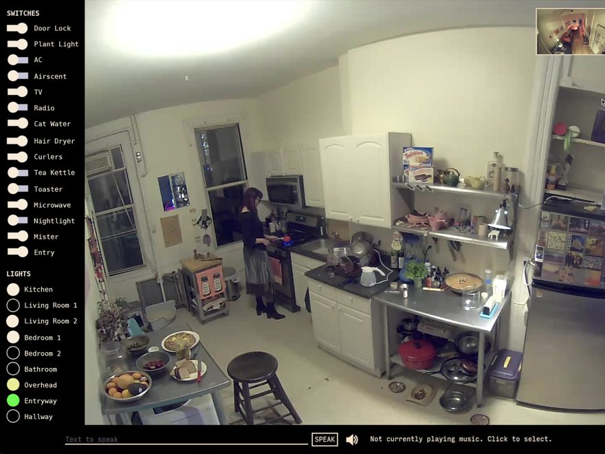 A screenshot of a smart home interface displaying a wide-angle, slightly distorted view of a kitchen and adjacent rooms.