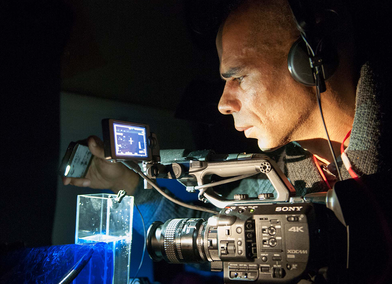 RCA PhD Candidate Wayne Binitie documenting Antarctic ice at the British Antarctic Survey (Credit - Pete Bucktrout, British Antarctic Survey).png