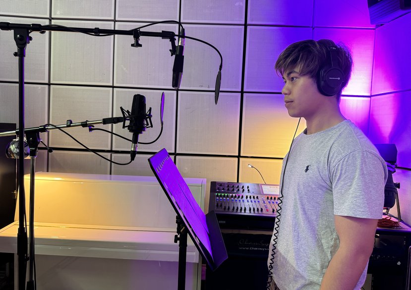 Kasidech Kumwongdee in the RCA audio recording studio at the Kensington campus, setting up the correct mic-stand-actor distances.