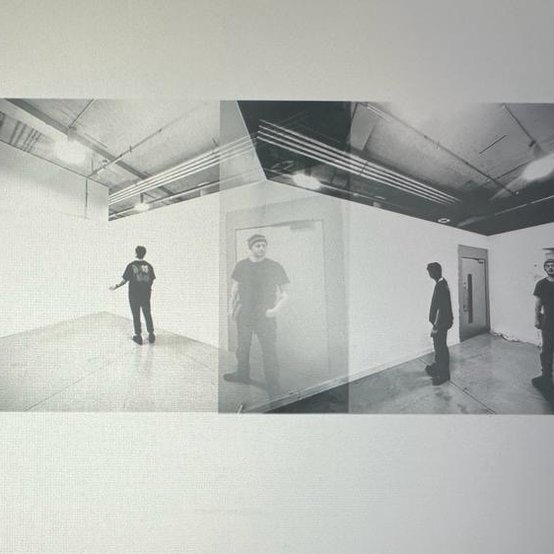Kasidech Kumwongdee with his AcrossRCA group examining their installation display space