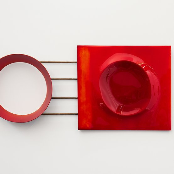Modern sculptural work with layers of red luminous automotive paint on salvaged steel and aluminium