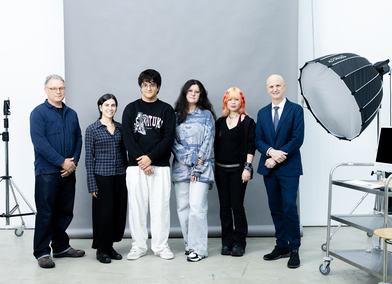 Future Stories participants photographed at the Royal College of Art Battersea campus with Professor James Coupe (left, Head of Programme, MA Photography) and Professor Christoph Lindner (right, President & Vice-Chancellor), credit RCA