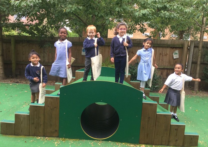 Children holding their PlayKit bags