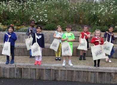 Children holding their Create & Learn PlayKit bags