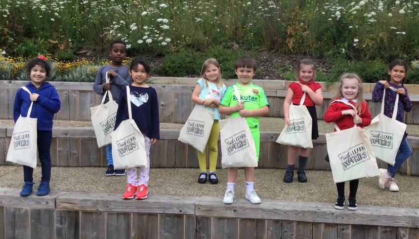 Children holding their Create & Learn PlayKit bags