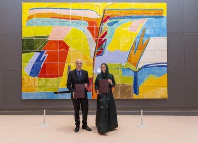 Professor Christoph Lindner & Ms Noha Kattan at a signing ceremony for the agreement
