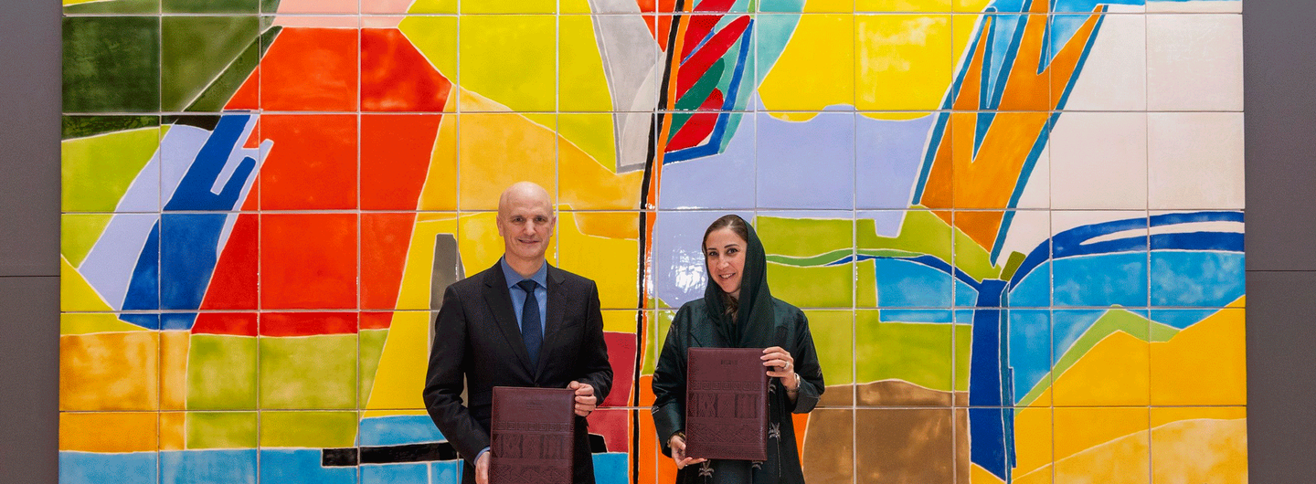 Professor Christoph Lindner & Ms Noha Kattan at a signing ceremony for the agreement