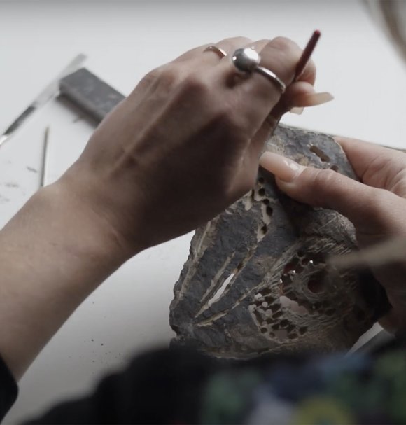 Sabina Petit Balcaityte carving a stone