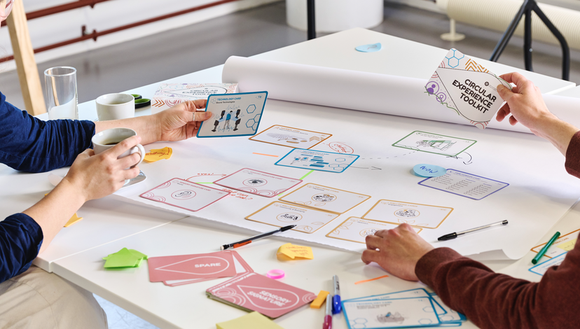 A white table with cards spread out over it