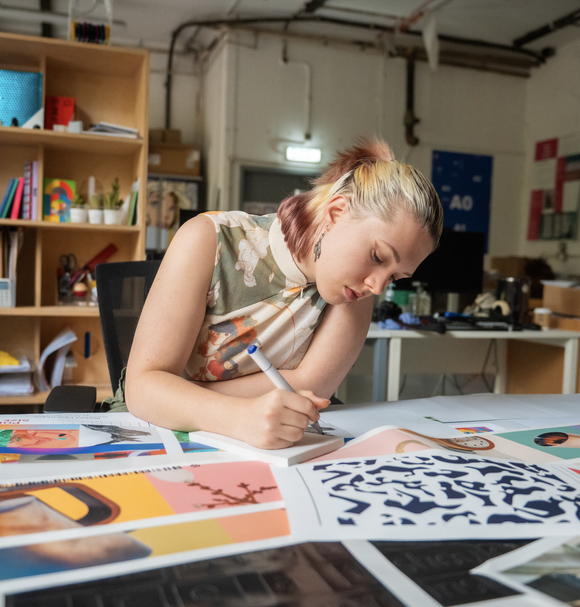 Student working on creative collaging