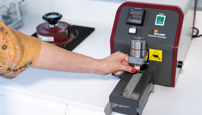 A hand using a machine