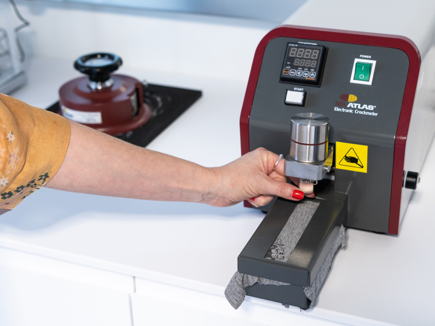 A hand using a machine