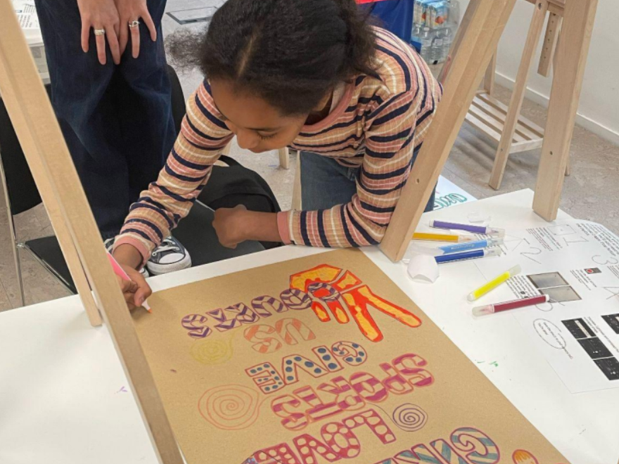 a young girl does a drawing