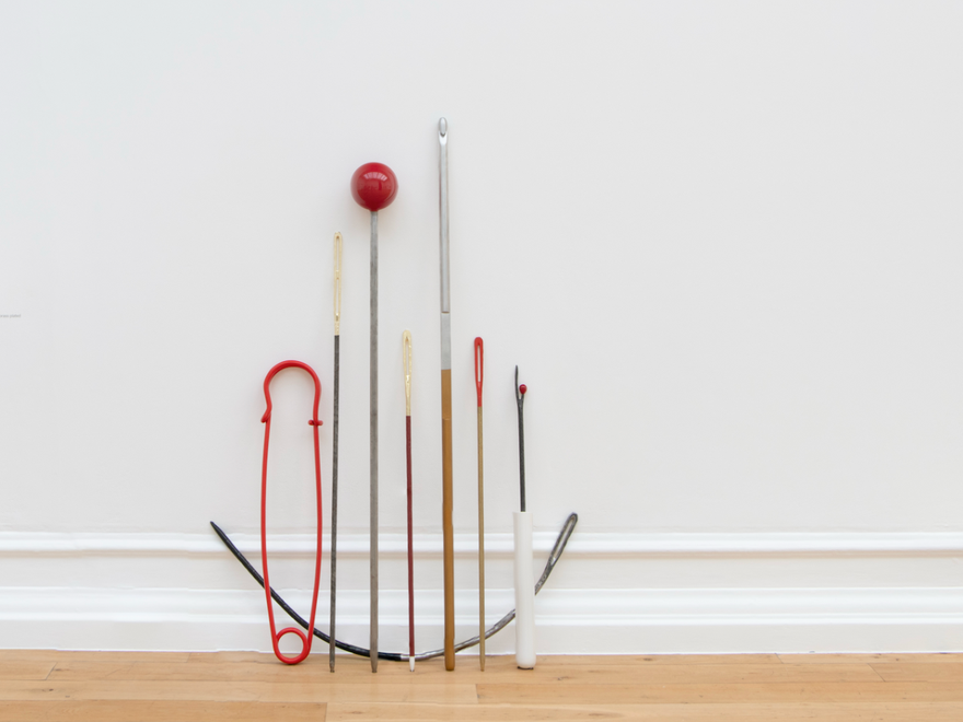A sculpture of needles and threads