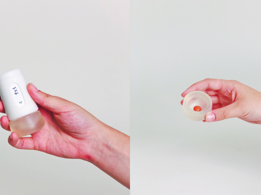 a photo of hands squeezing a tube