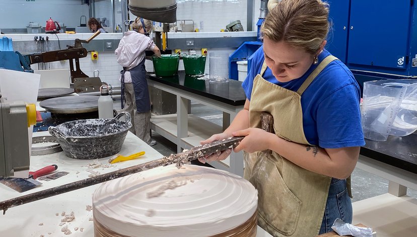 Serena Dicks carving a mold on the whirler