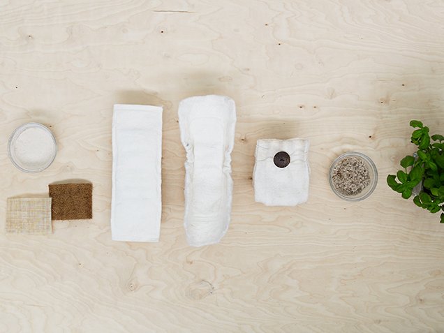Samples of raw and naturals materials are displayed in a line with prototypes of nappies