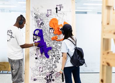 Visitors interacting with More Than a Swipe by Yuhan Zheng (Visual Communication) at RCA2026, credit ChrisLee copy